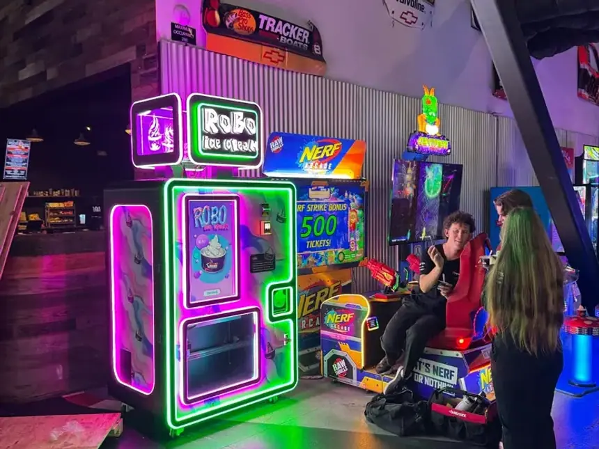 Robo Ice Cream next to arcade games at an entertainment venue